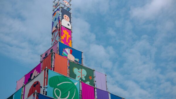 Colourful banners displayed on a stacked metal framework