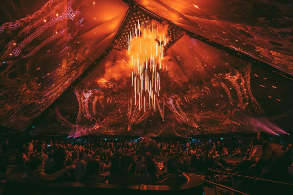 Light and laser show inside a giant pyramid-shaped exhibition room.