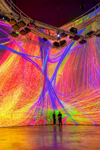 Huge screen display with brightly coloured projections