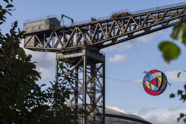 Glasgow Rose suspended from the Finnieston Crane during the Glasgow 2026 Commonwealth Games.